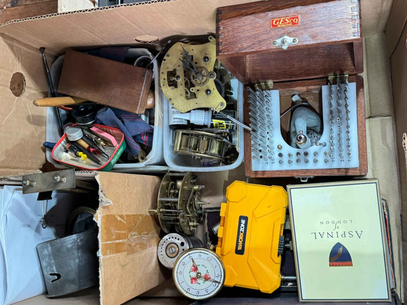 Three boxes of clock parts including movements, clock makers tools and accessories.