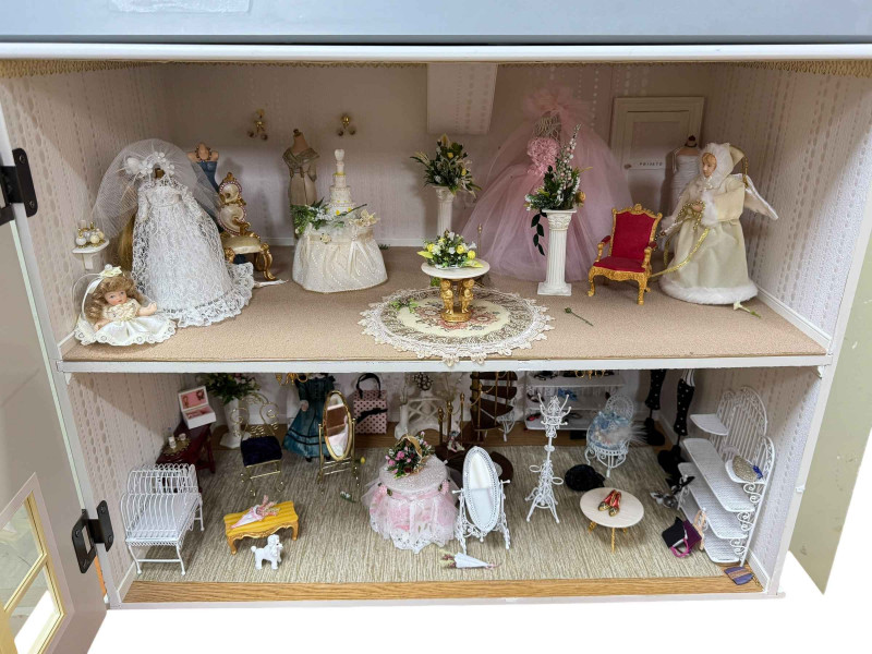 Large dolls house and furnishings and chest of accessories.