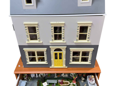 Large dolls house and furnishings and chest of accessories.