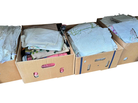Eleven boxes of assorted linen, bed covers, eiderdowns, and two boxes of jewellery boxes. thumbnail