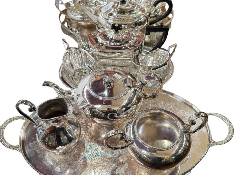 Four piece silver plated tea service and tray, and two three piece silver...