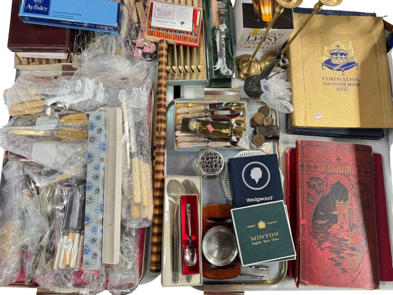 Collection of assorted cutlery, two coronation books, album of postcards, etc.