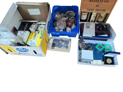 Box of coins and banknotes, vintage lighters, seashells, first day covers,...