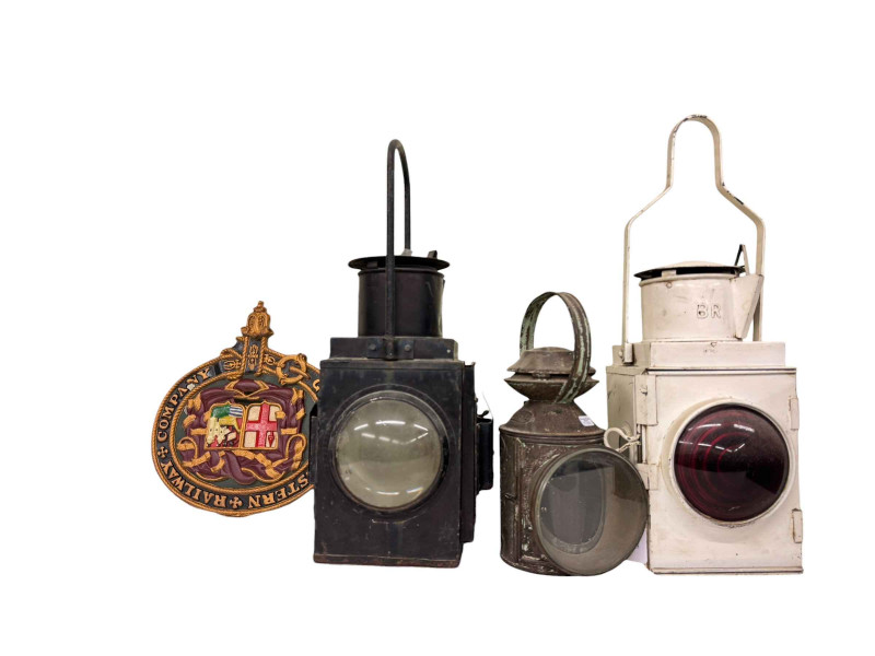 Three vintage railway lamps and a GWR plaque.