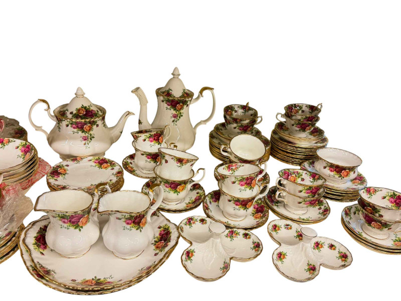 Collection of Royal Albert Country Roses dinner and teaware including two tureens, tea and coffee pot, cup, saucers and plates.