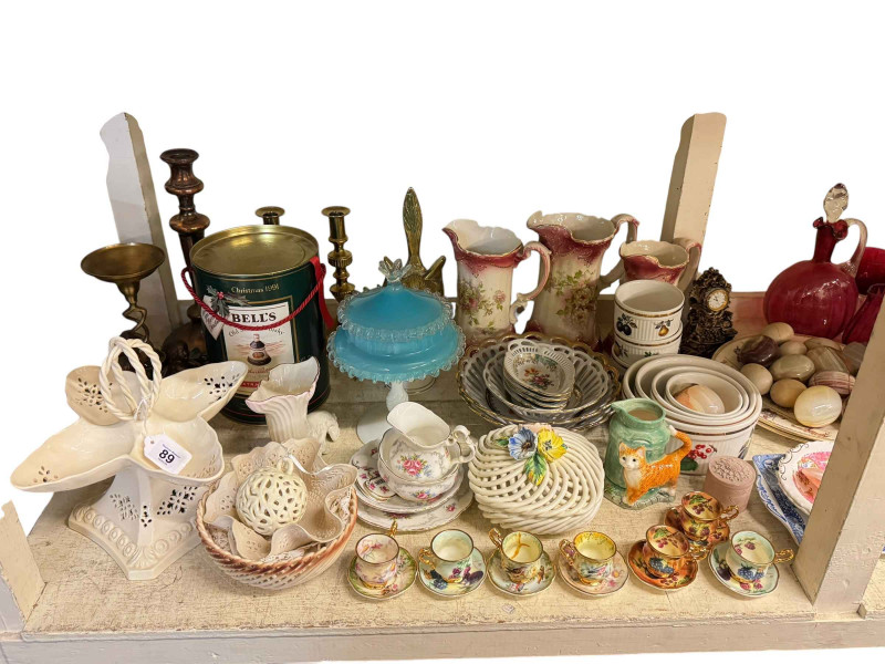 Large collection of glassware including paperweights and Victorian cranberry glass, kitchen scales, rope twist wood frame barometer, glass candlesticks, onyx eggs and assorted china.