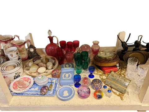 Large collection of glassware including paperweights and Victorian cranberry glass, kitchen scales, rope twist wood frame barometer, glass candlesticks, onyx eggs and assorted china. thumbnail