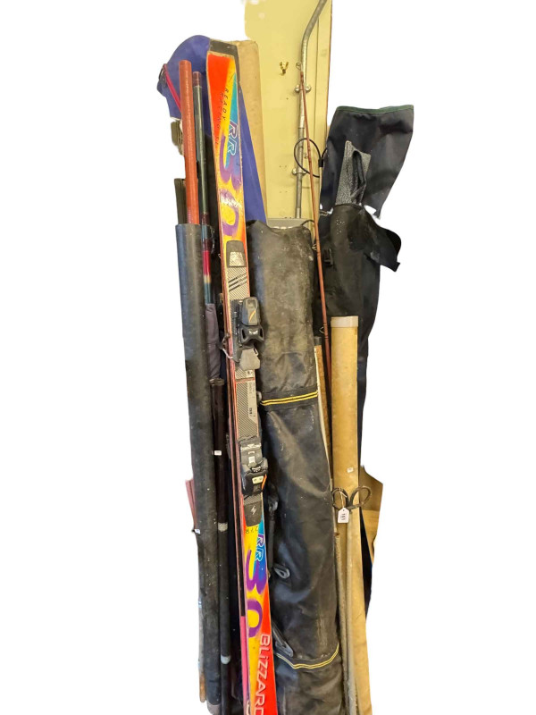 Large collection of fishing equipment including rods and reels, waders, landing and keep nets, folding chairs, trolley and accessories.