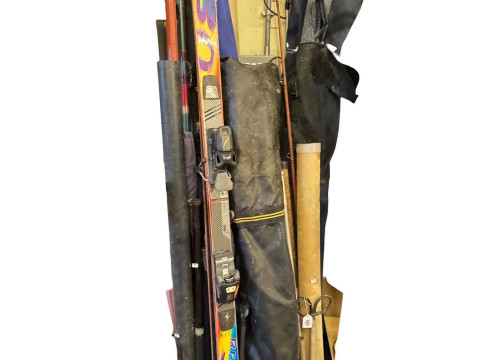 Large collection of fishing equipment including rods and reels, waders,...