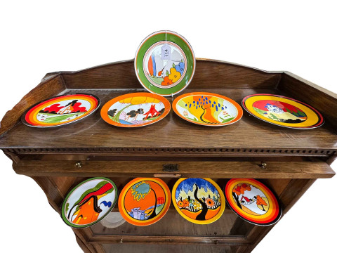 Nine Wedgwood Clarice Cliff plates.
