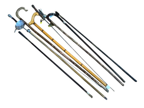 Collection of walking sticks and two fencing foils.