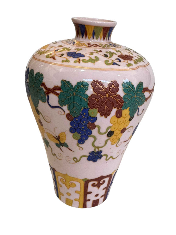 Chinese vine decorated vase with calligraphy to base, 16.5cm.