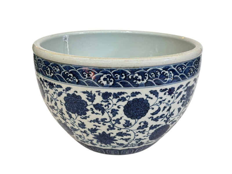 Chinese blue and white jardiniere with continuous foliate decoration, blue seal mark, 33cm diameter.