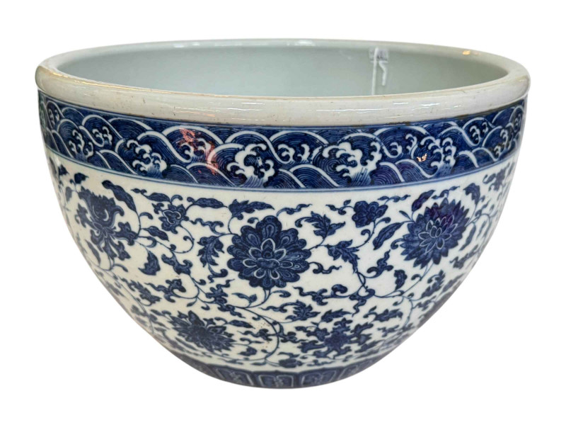 Chinese blue and white jardiniere with continuous foliate decoration, blue seal mark, 33cm diameter.