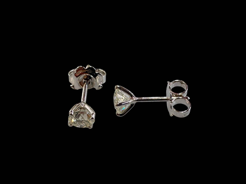 Pair of 18 carat white gold and diamond stud earrings (diamonds totalling 1 carat).