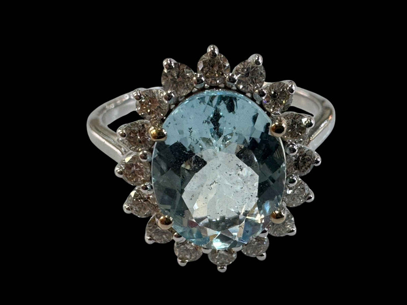 Aquamarine and diamond cluster ring set in 18 carat white gold (aquamarine 2.11 carats), size O.