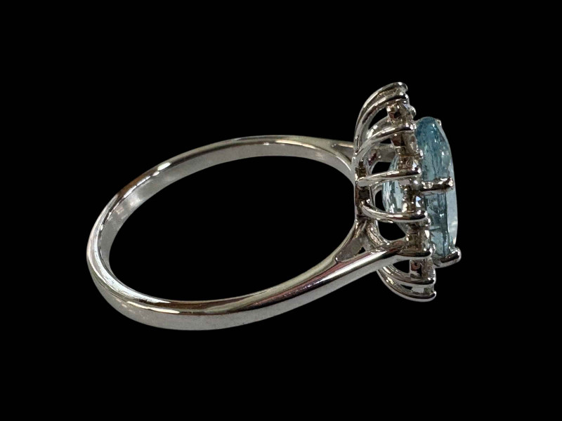 Aquamarine and diamond cluster ring set in 18 carat white gold (aquamarine 2.11 carats), size O.