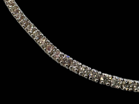 18 carat white gold and diamond tennis bracelet containing eighty round cut diamonds totalling over three carats. thumbnail
