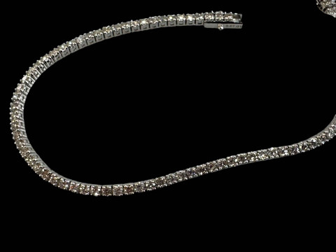 18 carat white gold and diamond tennis bracelet containing eighty round...