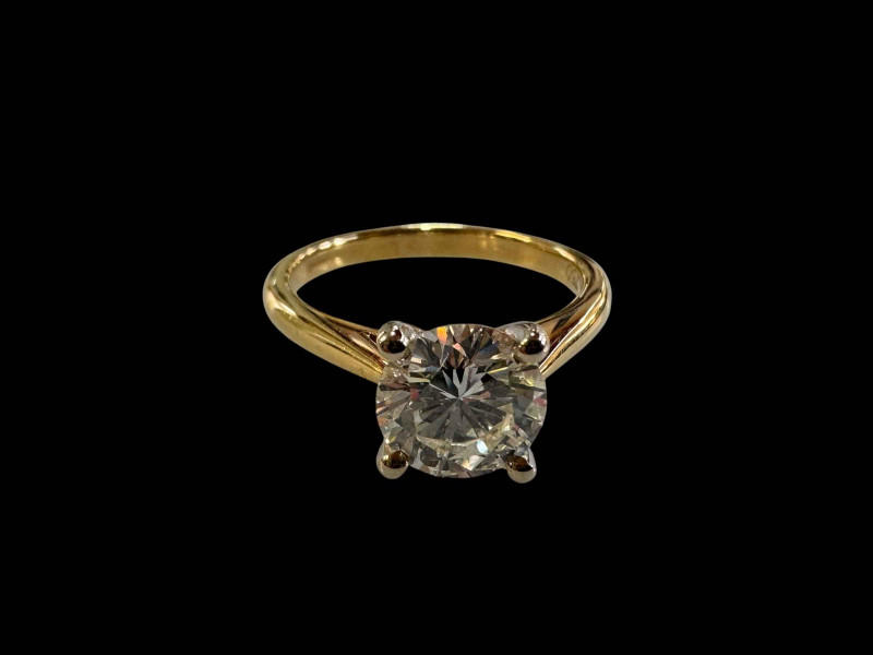 18 carat yellow and white gold claw set solitaire diamond ring, diamond 1.54 carats, size N.