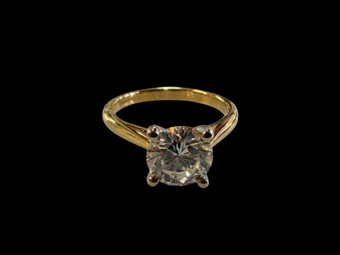 18 carat yellow and white gold claw set solitaire diamond ring, diamond...