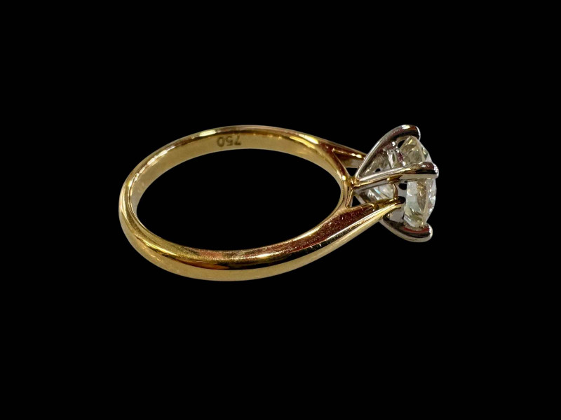 18 carat yellow and white gold claw set solitaire diamond ring, diamond 1.54 carats, size N.