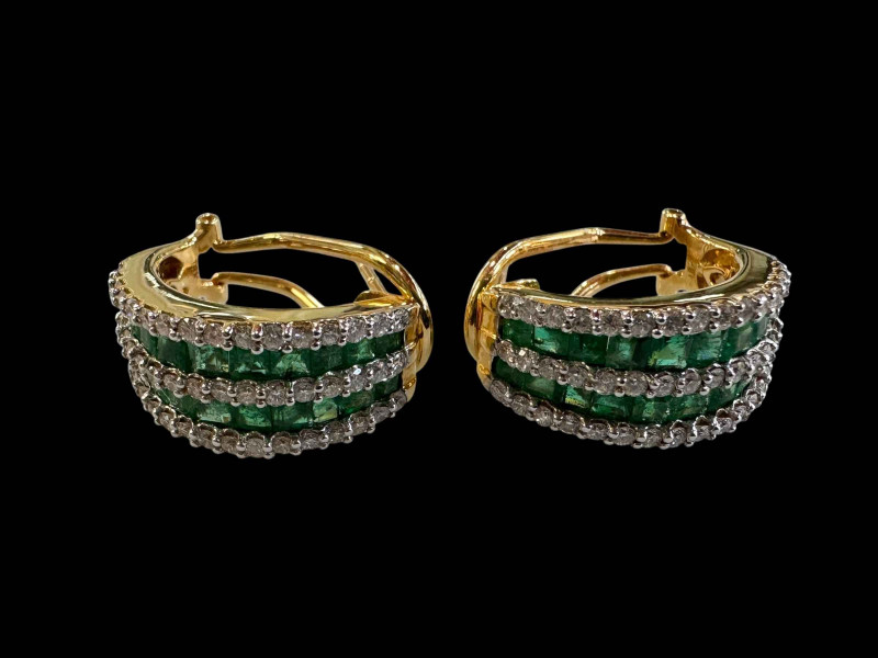 Pair of stunning emerald and diamond set 18k gold half loop earrings, each having 22 graduated emeralds and 48 diamonds.