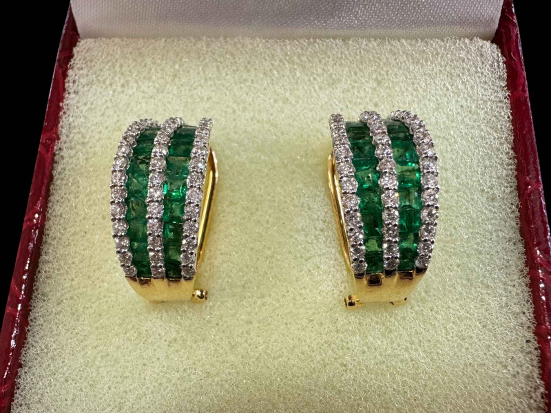 Pair of stunning emerald and diamond set 18k gold half loop earrings, each having 22 graduated emeralds and 48 diamonds.