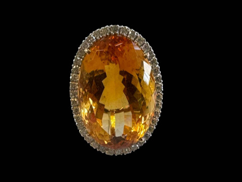 Large oval citrine and diamond cluster ring set in unmarked gold, diamond...