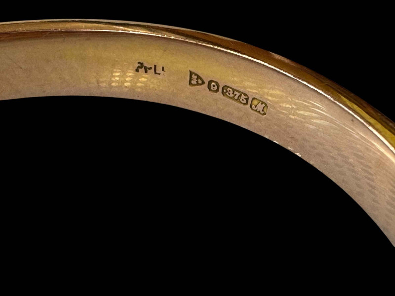 9 carat gold bangle with bead and engraved decoration, hallmarked Chester 1912, with box.
