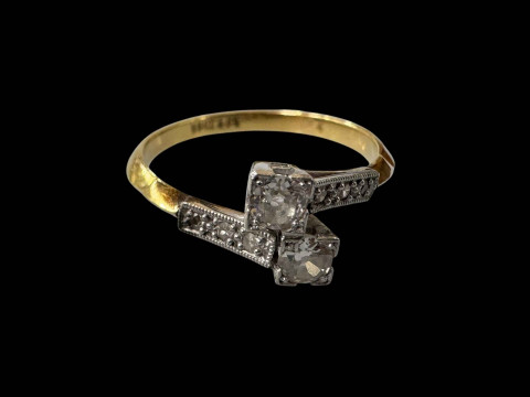 Diamond 18 carat gold and platinum ring with crossover setting, size N.