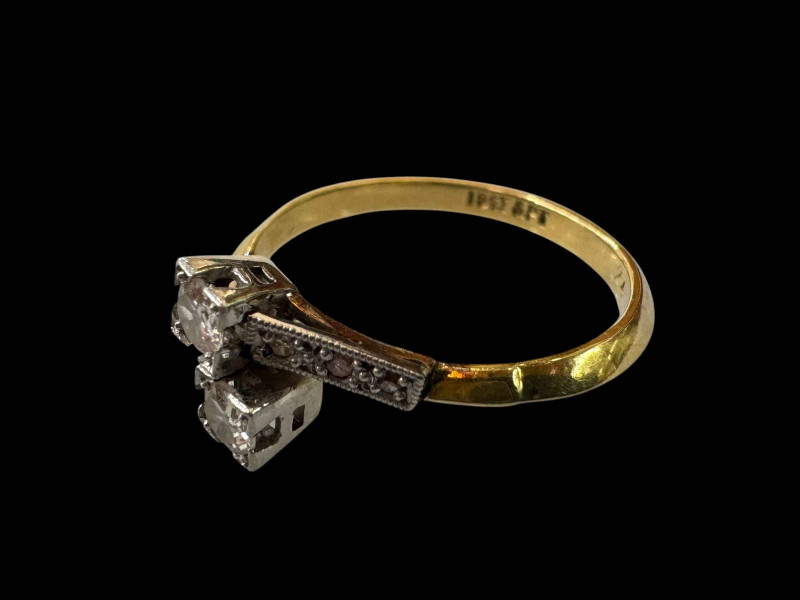 Diamond 18 carat gold and platinum ring with crossover setting, size N.
