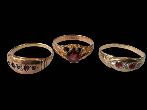 Three gold gem set rings, one with stones missing, two hallmarked 9 carat.