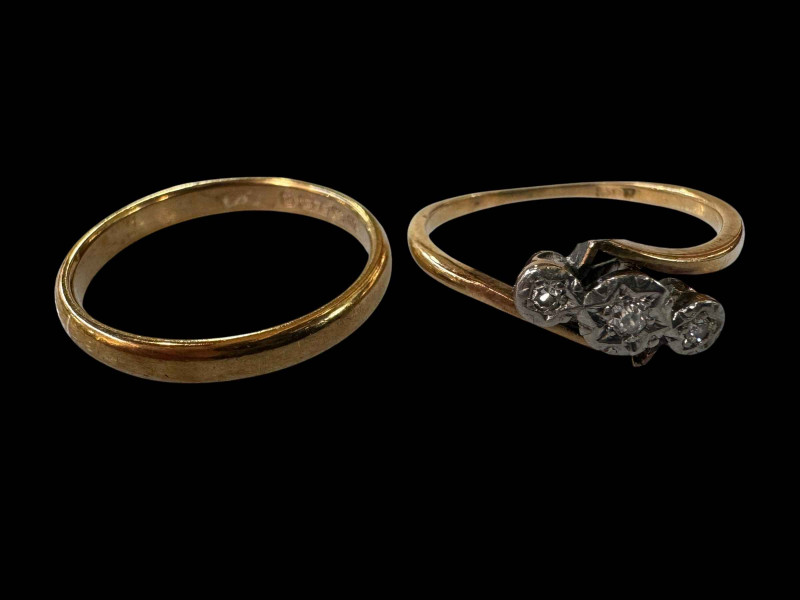 18 carat gold three stone diamond ring and 9 carat gold wedding band.