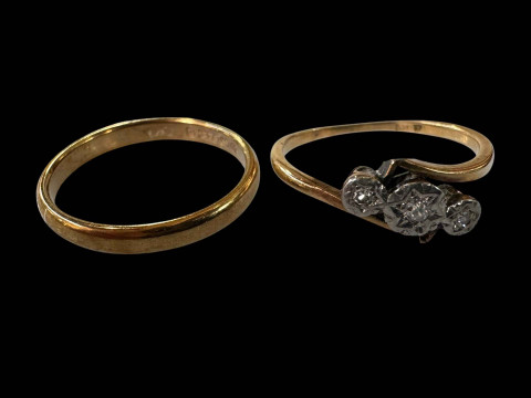 18 carat gold three stone diamond ring and 9 carat gold wedding band.