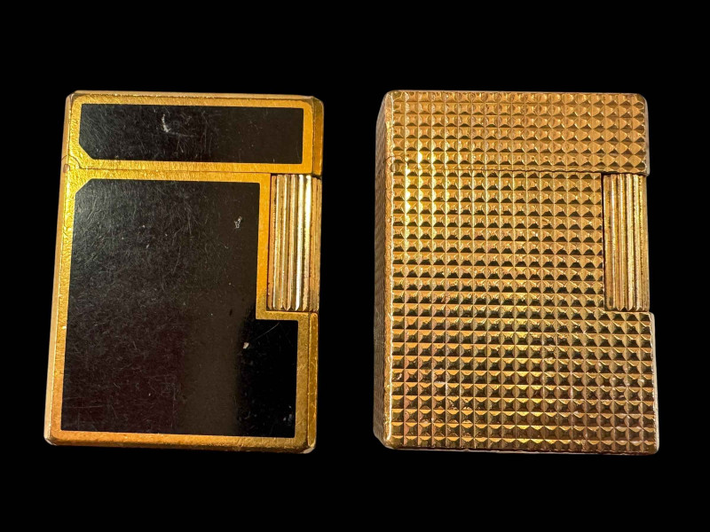 Two vintage Dupont, Paris cigarette lighters, gold plated and black lacquer.