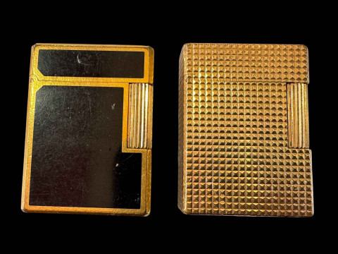 Two vintage Dupont, Paris cigarette lighters, gold plated and black lacquer.