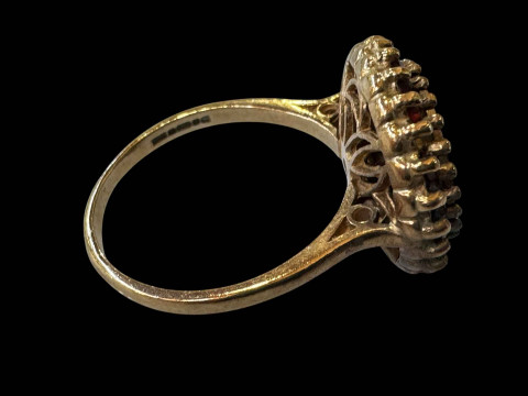 9 carat gold ring with Mexican coins and garnet border. thumbnail