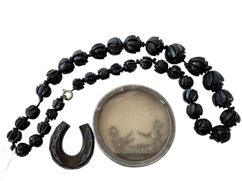 Victorian novelty acrobatic couple, along with jet? bracelet and horseshoe...