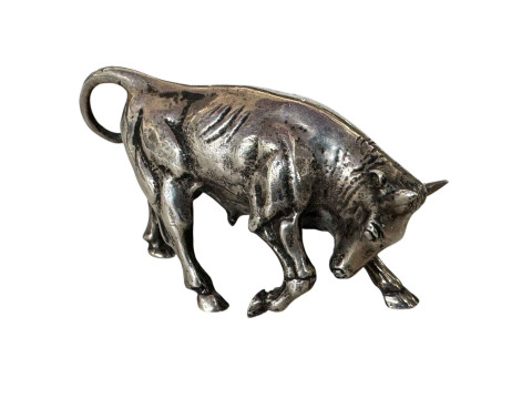 S Kirk & Sons silver charging bull with tail down, 7.5cm length.
