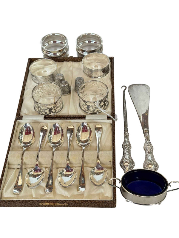 Collection of silver comprising six teaspoons, six napkin rings, three thimbles, open salt and silver handled button hook and shoe horn (12).
