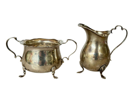 Silver sugar basin and a cream jug, Birmingham and Chester hallmarked...
