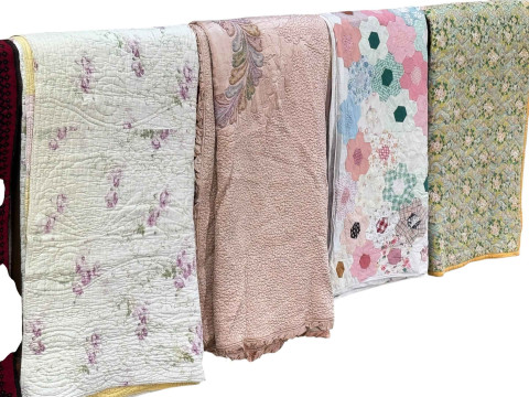 Four assorted quilts including patchwork.