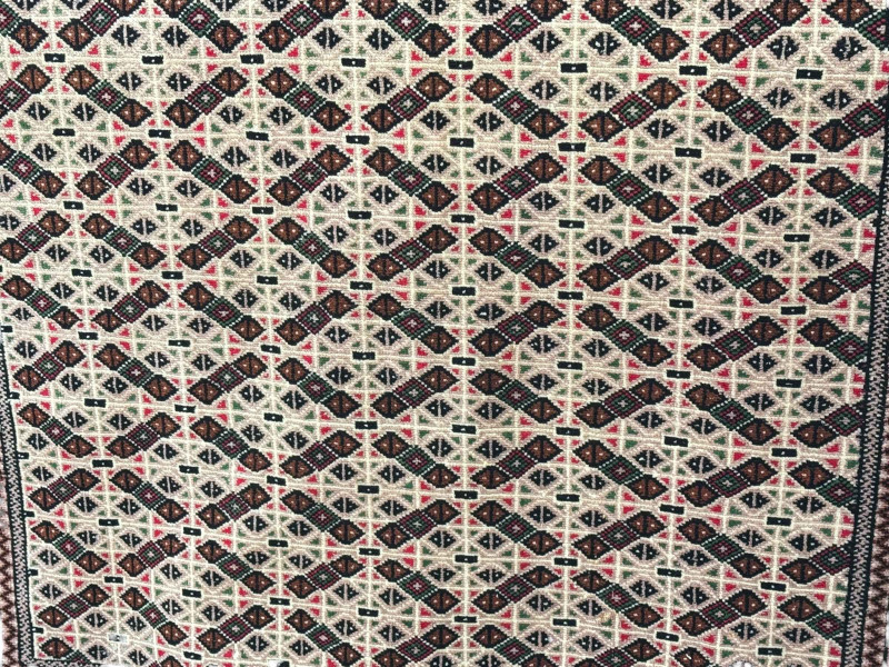 Beige ground hand knotted Persian Turkaman carpet 168cm by 130cm.