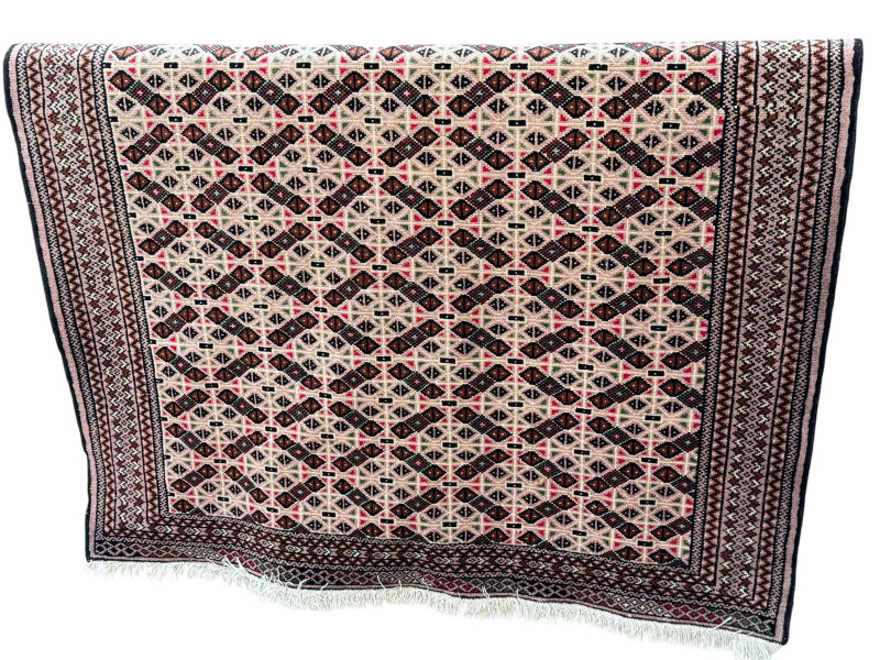 Beige ground hand knotted Persian Turkaman carpet 168cm by 130cm.