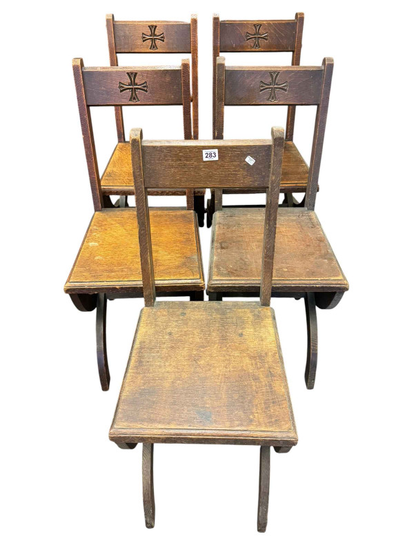 Five oak ecclesiastical chairs.