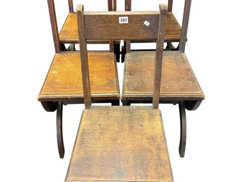Five oak ecclesiastical chairs.