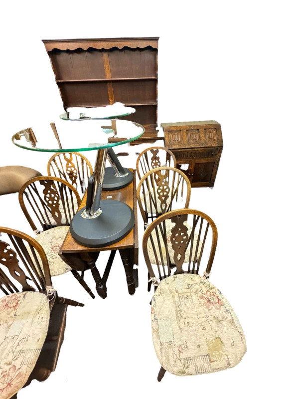 Old Charm style oak dresser, drop leaf table, six wheel back chairs and linen fold bureau.
