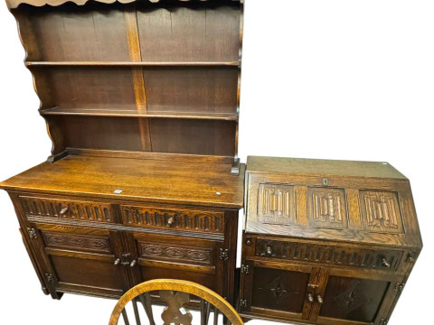 Old Charm style oak dresser, drop leaf table, six wheel back chairs and linen fold bureau. thumbnail