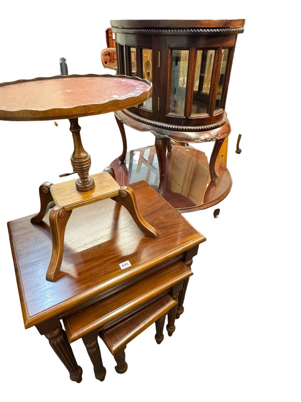 Mahogany display table, circular coffee table, nest of tables and a wine table.